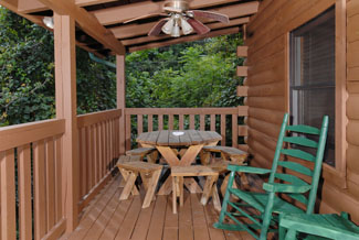 Tennessee Vacation Cabin Rental that features a quiet outdoor seating area and picnic table